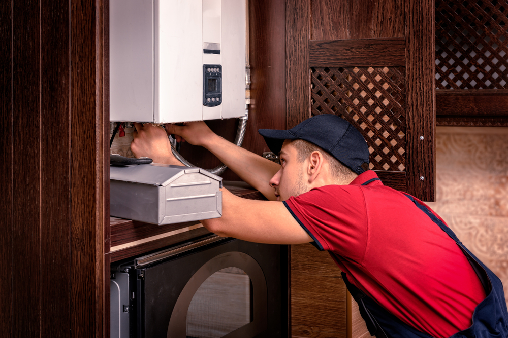 Plumber,Adjusts,Gas,Boiler,Before,Operating.