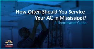 Technician performing air conditioning maintenance on indoor AC unit in Mississippi home